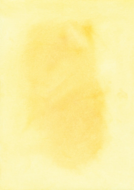 Foto manchas de acuarela amarilla sobre papel con espacio para texto