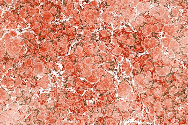 Foto manchas de líquido rojo con rayas blancas en la superficie.