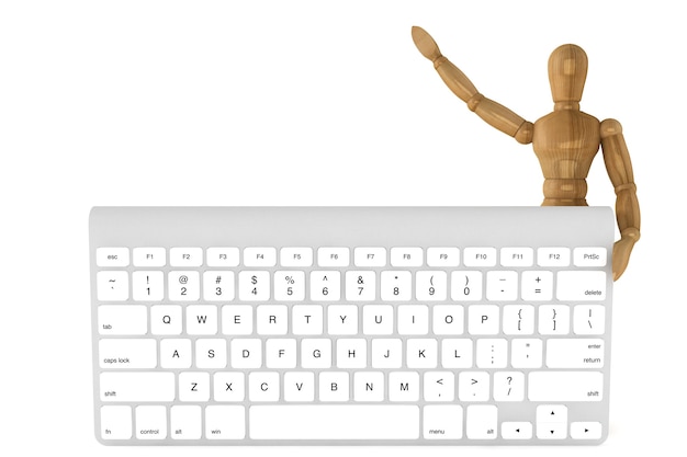 Maniquí de madera con teclado de computadora sobre un fondo blanco.