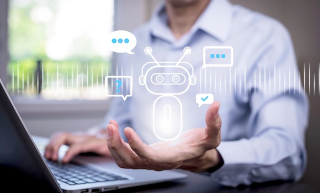 Mann mit Laptop und Touchbar Chatbot Chat mit KI Künstliche IntelligenzSystem Künstliche Intelligence ein Künstlicher Intelligenz Chatbot Digitaler Chatbot Robot Anwendung Konversation