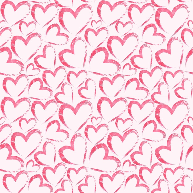 Foto mano acuarela dibujada de patrones sin fisuras con corazones en superficie rosa claro