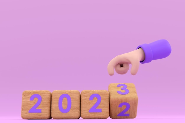 Mano y cubos con 2022 23 representa el nuevo año 2023