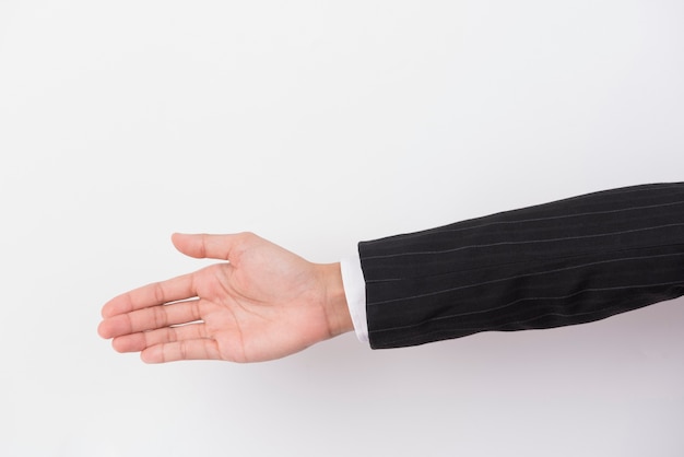 Foto la mano de un hombre de negocios se extiende