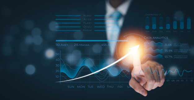 Mano de hombre de negocios tocando flecha gráfico de negocios de pantalla virtual en el fondo negro análisis de datos de ventas La gente de negocios de tecnología moderna elige con un diagrama analítico de dedo con grandes datos