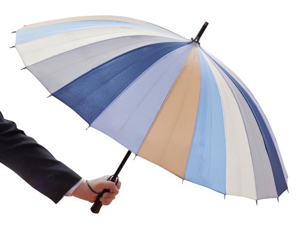 Foto mano de hombre con paraguas multicolor abierto