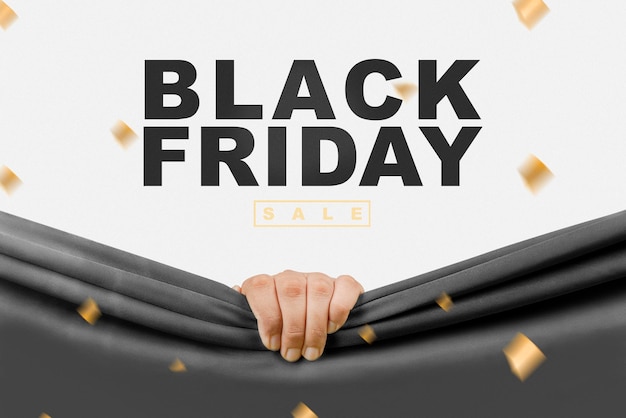 Mano humana abriendo cortina negra con texto de venta de Black Friday