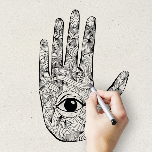 Mano de mandala esotérica con dibujo de ojos sobre textura ligera Adorno oriental y concepto de hinduismo