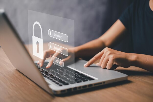 La mano de la mujer escribiendo en el teclado con el nombre de usuario y la contraseña en la pantalla muestra el concepto de seguridad cibernética protección de datos y acceso seguro a Internetx9