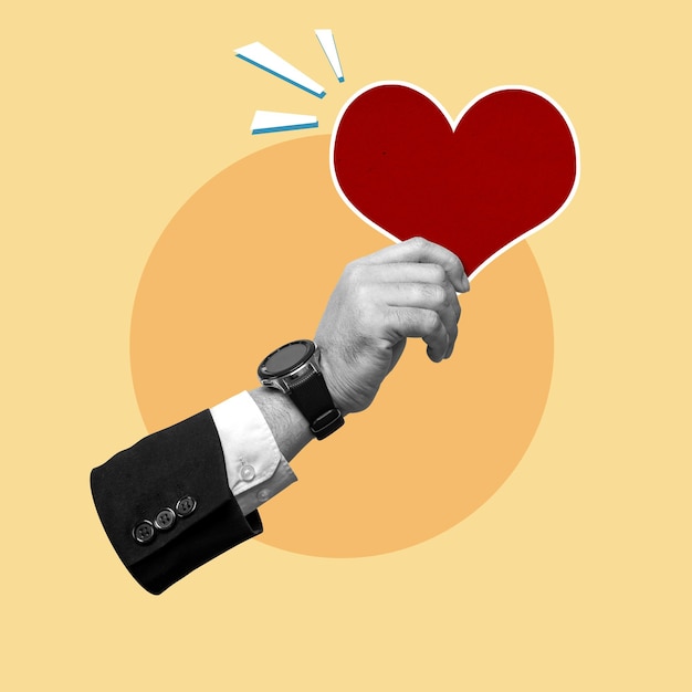 Mano de negocios con un corazón rojo