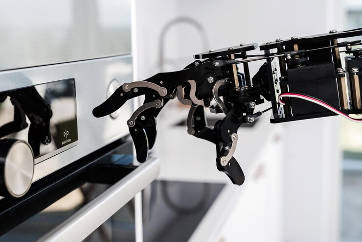 Foto mano de robot real y horno eléctrico concepto de automatización de procesos robóticos