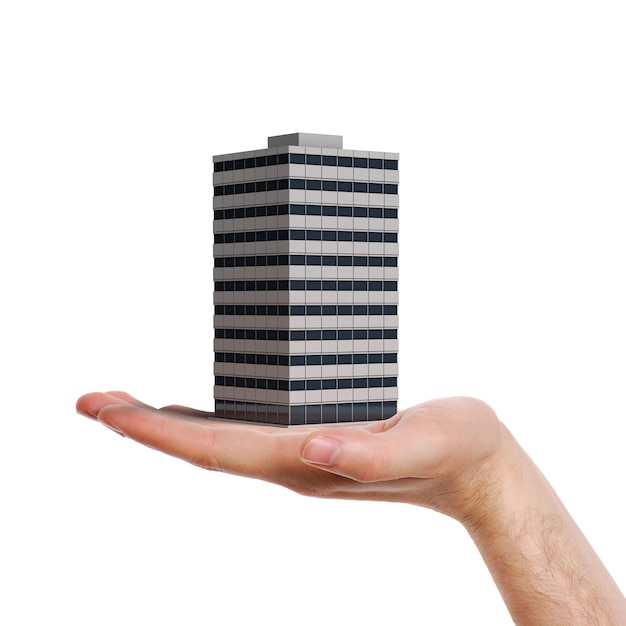 mano sosteniendo un edificio de oficinas