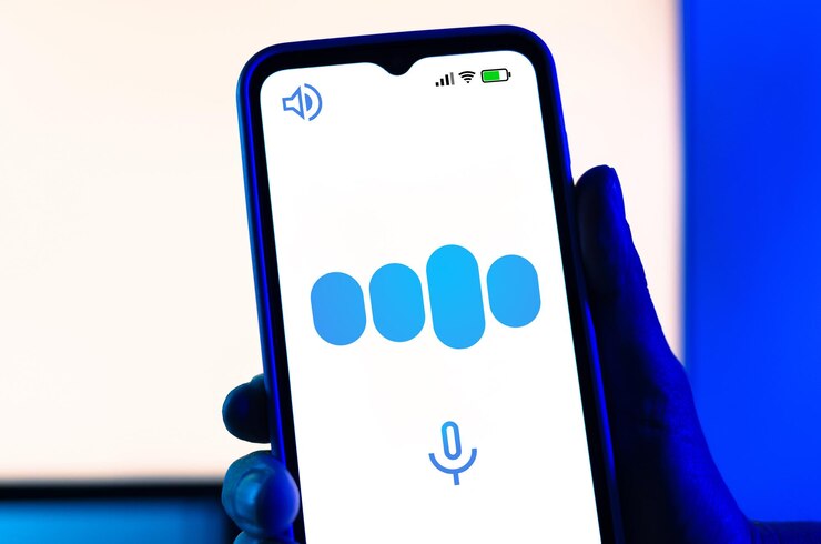 Foto una mano sostiene un teléfono inteligente que muestra un gráfico de forma de onda que representa una ia que responde a una voz