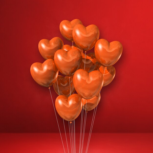 Manojo de globos de forma de corazón naranja sobre una pared roja. Ilustración 3D render