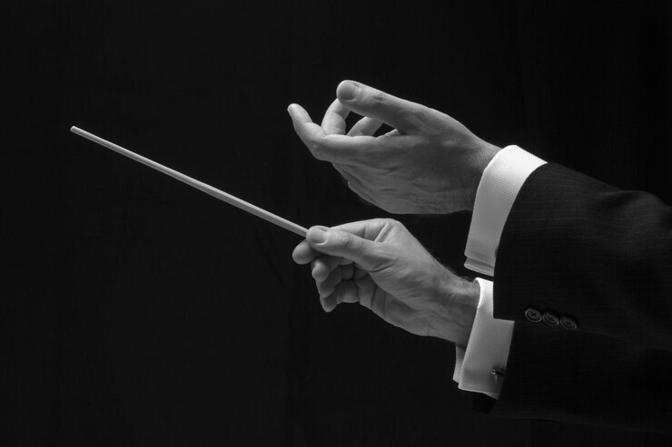 Foto manos de director de música