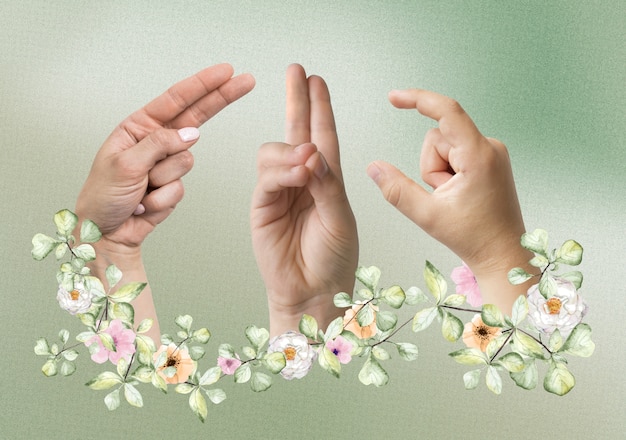 Foto manos florales usando lenguaje de señas