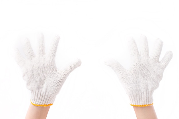 Manos con guantes de algodón industrial