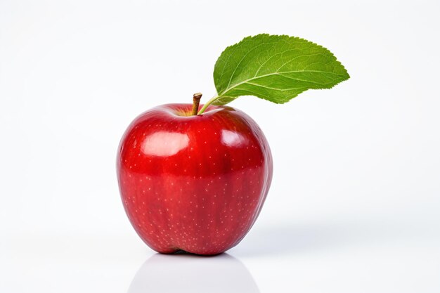 Foto una manzana roja con una hoja en la parte superior