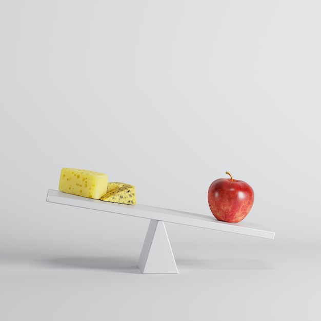 Foto manzana roja que inclina el balancín con queso en el extremo opuesto en el fondo blanco.