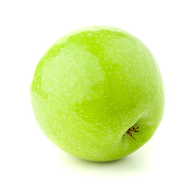 Manzana verde sobre un fondo blanco con una sombra