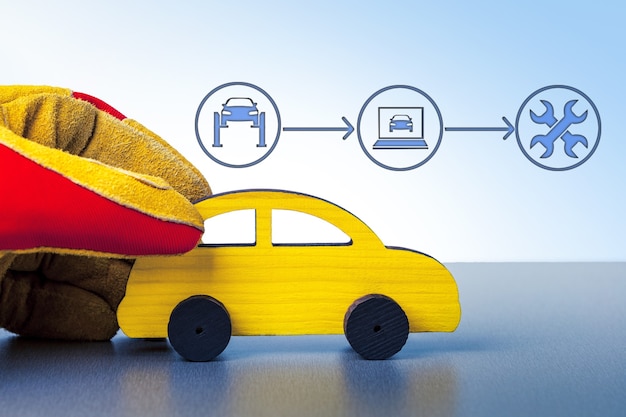 Mão Com Carro. Serviço de carro, reparo, diagnóstico, conceito de manutenção.