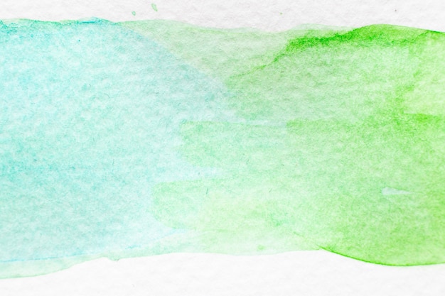 Mão de aquarela verde e azul claro cor desenhada como pincel ou banner