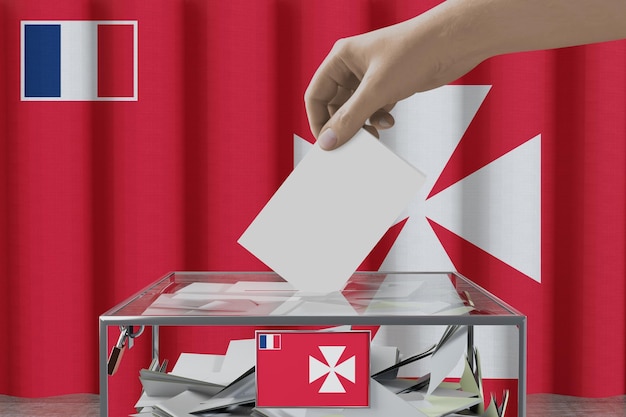 Foto mão de bandeira uvea deixando cair o cartão de cédula em uma ilustração 3d do conceito de eleição de votação de caixa