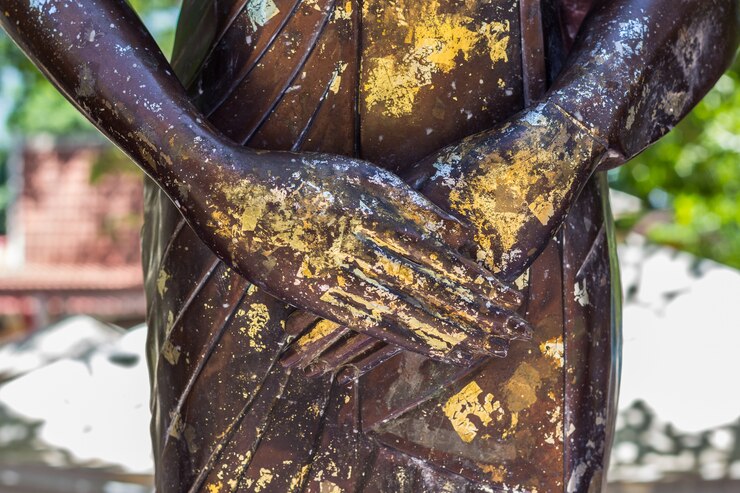 Foto mão, de, buddha, estátua