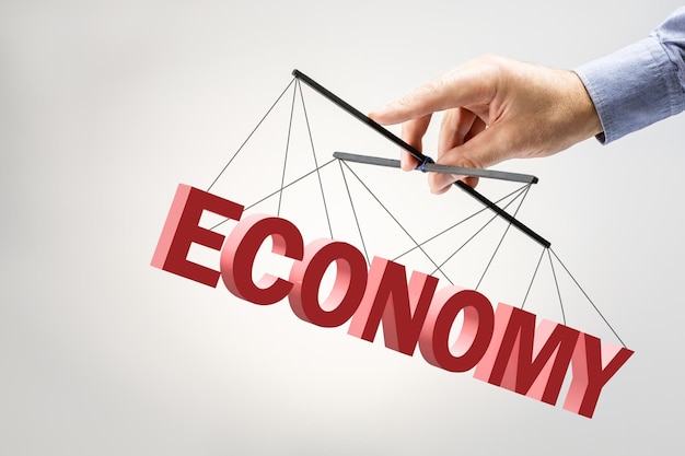 Mão de empresário controlando o crescimento econômico na economia Empresário mantendo o crescimento na economia