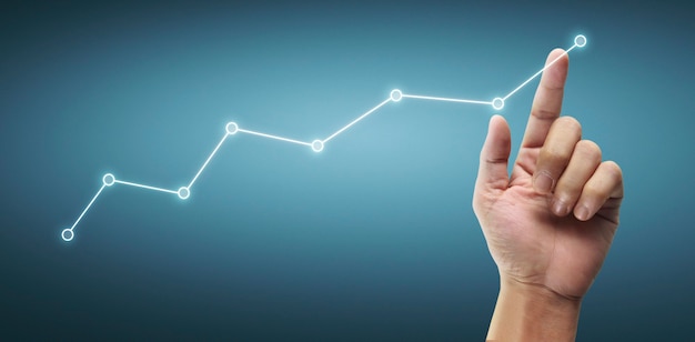 Mão tocando um gráfico de indicador financeiro e gráfico de análise de economia de mercado contábil