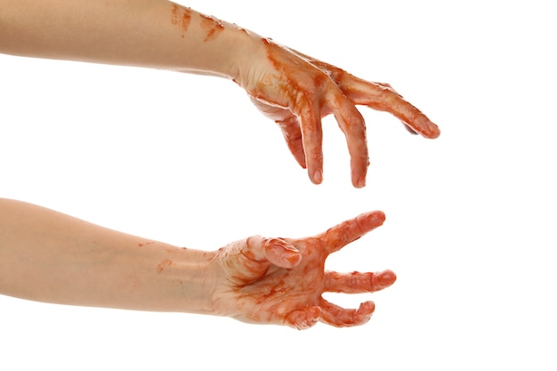 Mãos de zumbi de sangue isoladas no branco
