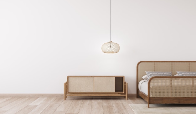 Foto maqueta interior de dormitorio luminoso, cama de ratán de madera en la pared blanca vacía