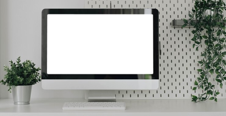 Foto maqueta de laptop con pantalla en blanco en el escritorio espacio de trabajo con laptop y suministros de oficinaxa