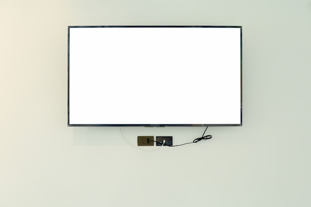 Foto maqueta de pantalla de televisión led tv / maqueta, en blanco sobre fondo de pared blanca