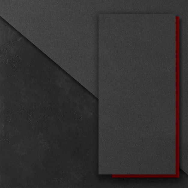 Maquetas rectangulares negras y rojas sobre un fondo de hormigón oscuro Elementos de diseño o cartera