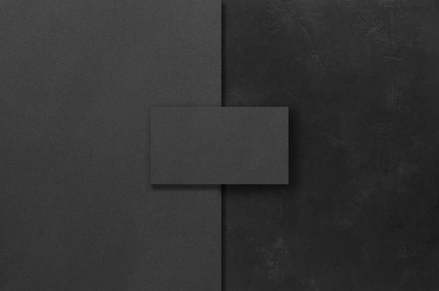 Foto maquetas rectangulares negras sobre un fondo de hormigón oscuro elementos de diseño o cartera espacio de copia