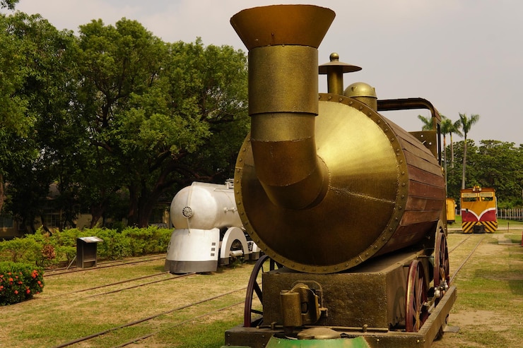 Foto máquinas antigas no campo contra árvores