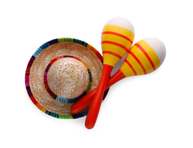 Foto maracas coloridas e chapéu sombrero isolados na vista superior branca instrumento musical