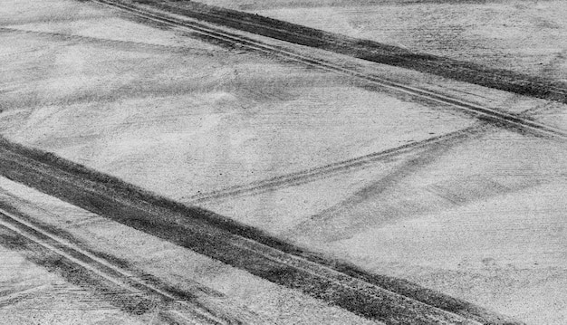 Marca de pista de pneus em asfalto asfalto pista de corrida de estrada textura e fundo fundo abstrato preto