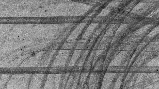 Marca de pista de pneus em asfalto asfalto pista de corrida de estrada textura e fundo fundo abstrato preto