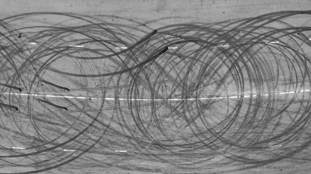 Marca de trilha de pneu de vista aérea na textura e plano de fundo da pista de corrida de estrada de asfalto Abstrato derrapagem de pista de pneu preto na estrada de asfalto Marca de derrapagem de marca de pneu na estrada de asfalto