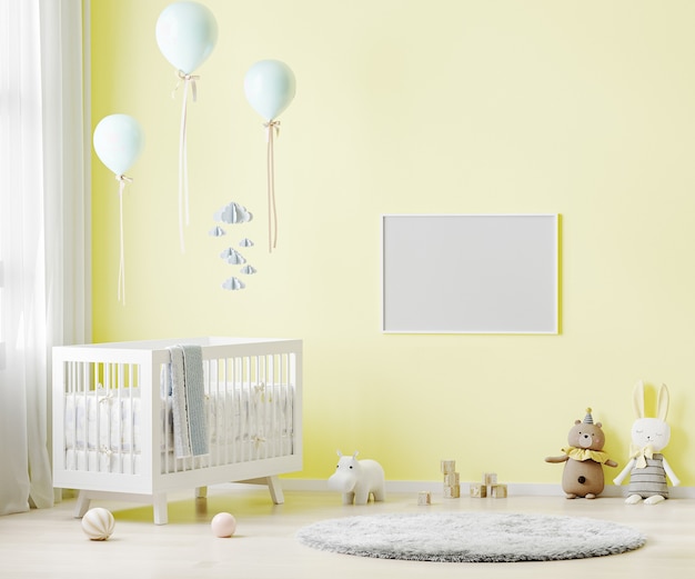 Marco horizontal en blanco en la pared amarilla en el fondo interior de la sala de guardería con ropa de cama para bebés