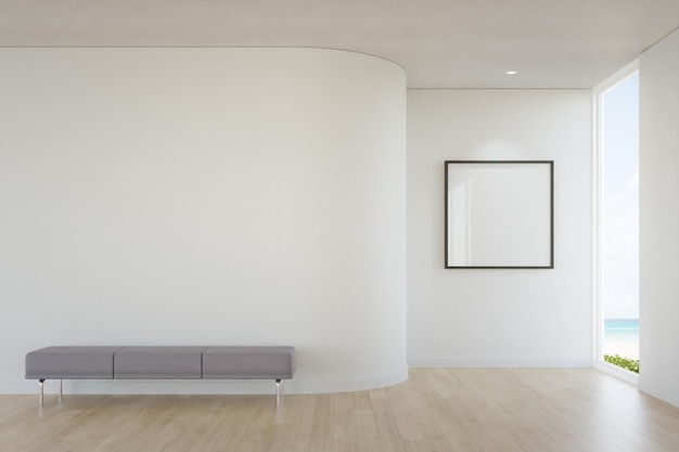 Foto marco de imagen en blanco vacío y banco en el suelo de madera de la luminosa sala de estar en la casa de la playa