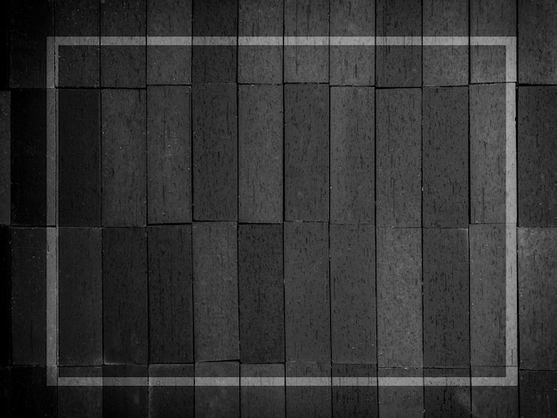 Marco de línea blanca con espacio en blanco sobre fondo de textura de madera oscura estilo vertical Montaje de muchas piezas de paneles de madera negros y grises patrón de rayas de pared fondo de pared o piso