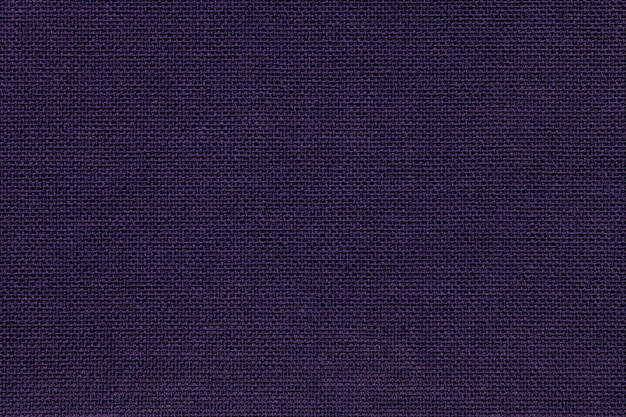 Marineblauhintergrund von einem Textilmaterial mit Weidenmuster, Nahaufnahme.