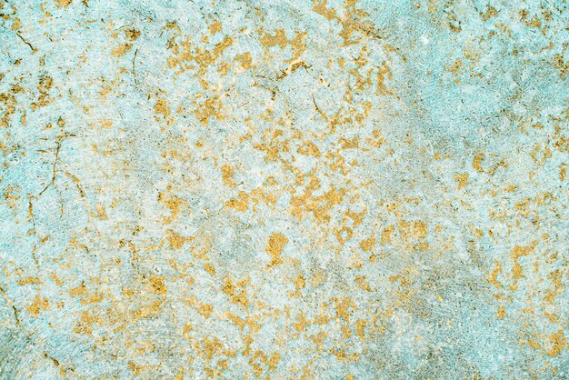 Mármore, textura de concreto envelhecida. velho, vintage celadon verde, fundo Fortuna Gold. ouro com rugosidade e fissuras.