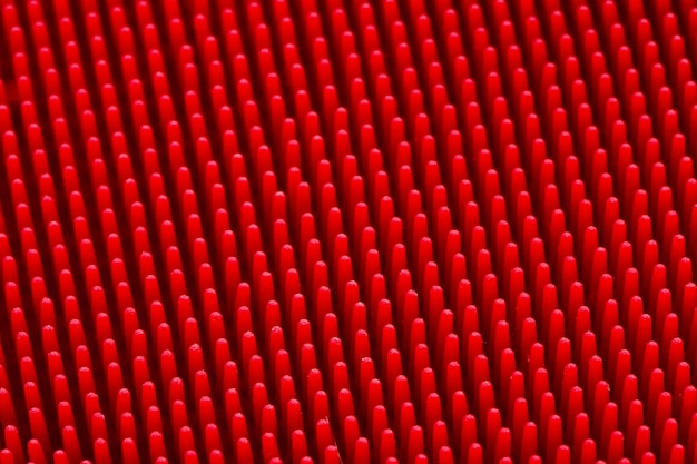 Masaje de silicona roja impetuosa textura superficial de cerca para el fondo