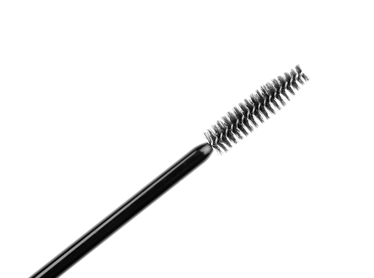 Foto mascara-stab auf weißem hintergrund