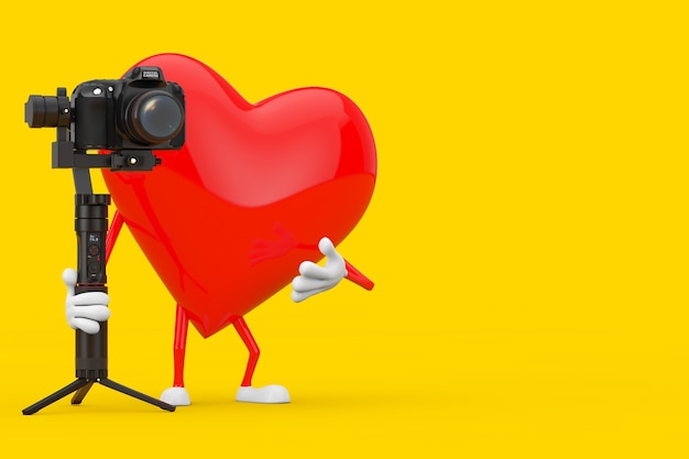 Mascota de personaje de corazón rojo con DSLR o sistema de trípode de estabilización de cardán de cámara de video sobre un fondo amarillo. Representación 3D