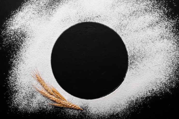 Massa ou pão cozinhar ingredientes na mesa da cozinha preta. Vista superior com espaço para seu texto