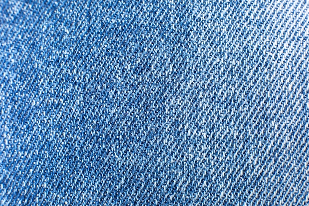 Material de jeans azul hipster. Fondo de textura de tela de mezclilla.